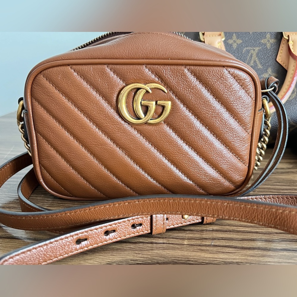 Sold on e b a yGucci Mini Camera bag in Brown